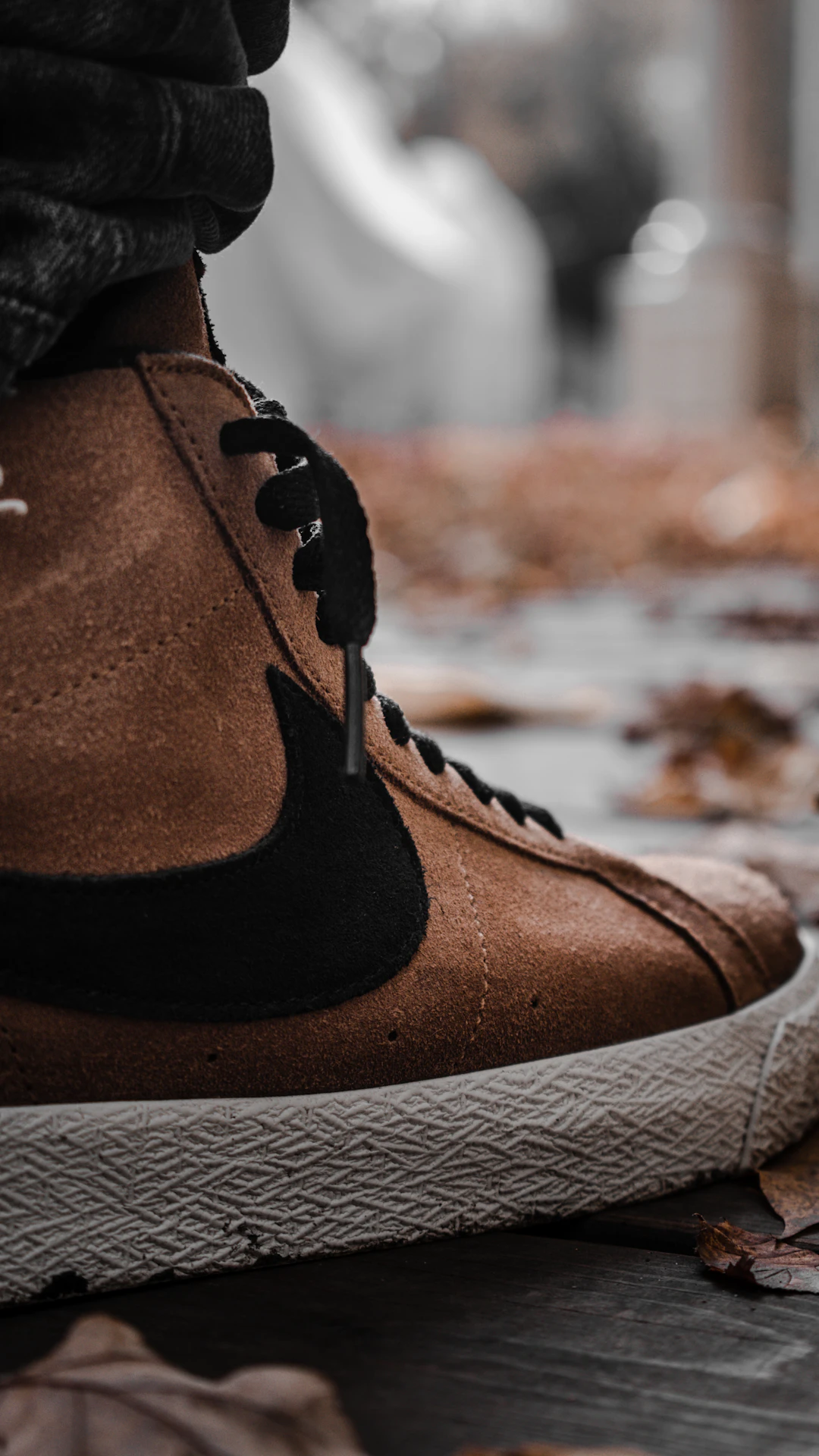 person wearing brown leather boots