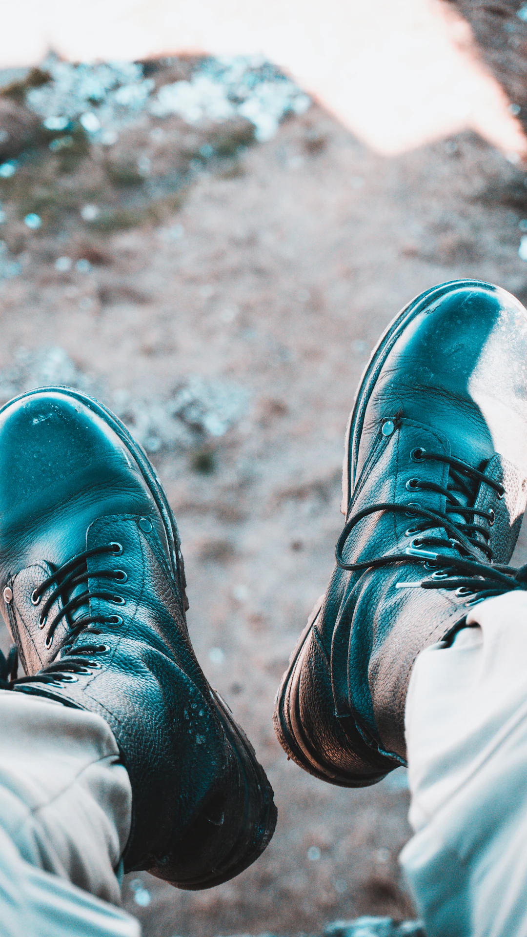 person wearing black leather lace up shoes