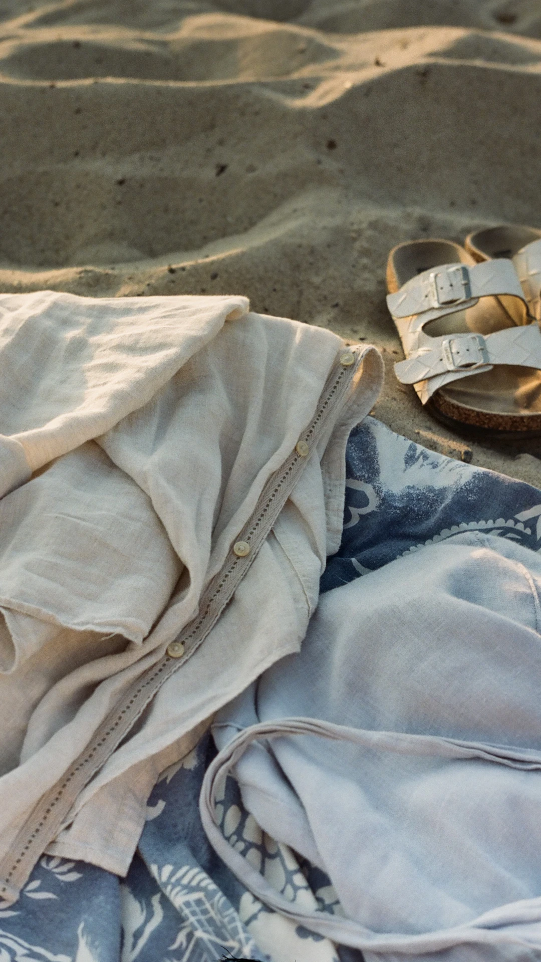 a pair of shoes on a beach